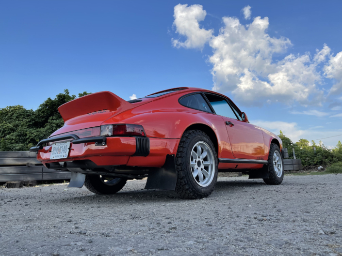 Rear View of Leh Keen's Custom 1984 911 Carrera in Blood Orange with Mercedes 300SL fabric