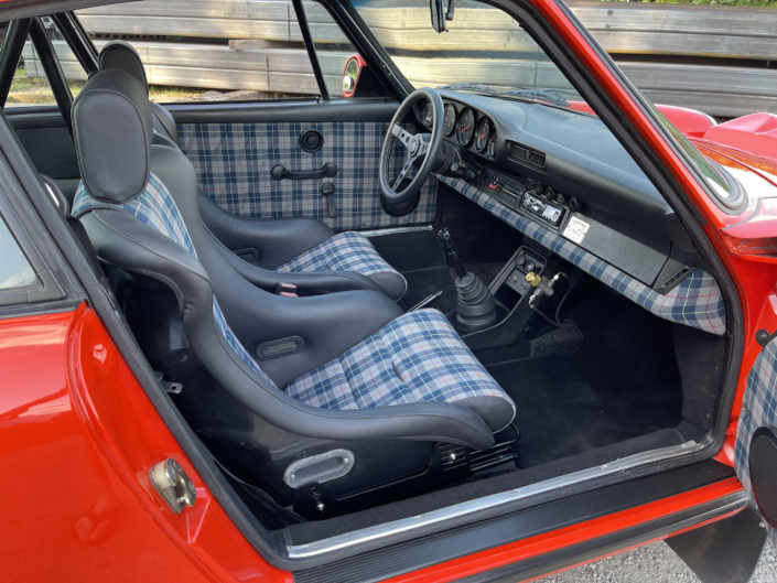 Interior view of Leh Keen's Custom 1984 911 Carrera in Blood Orange with Mercedes 300SL fabric.