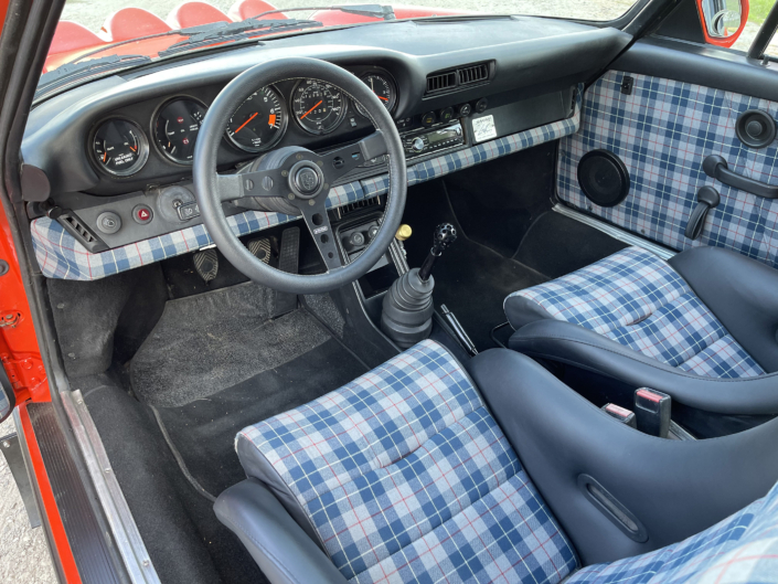 Interior view of Leh Keen's Custom 1984 911 Carrera in Blood Orange with Mercedes 300SL fabric.